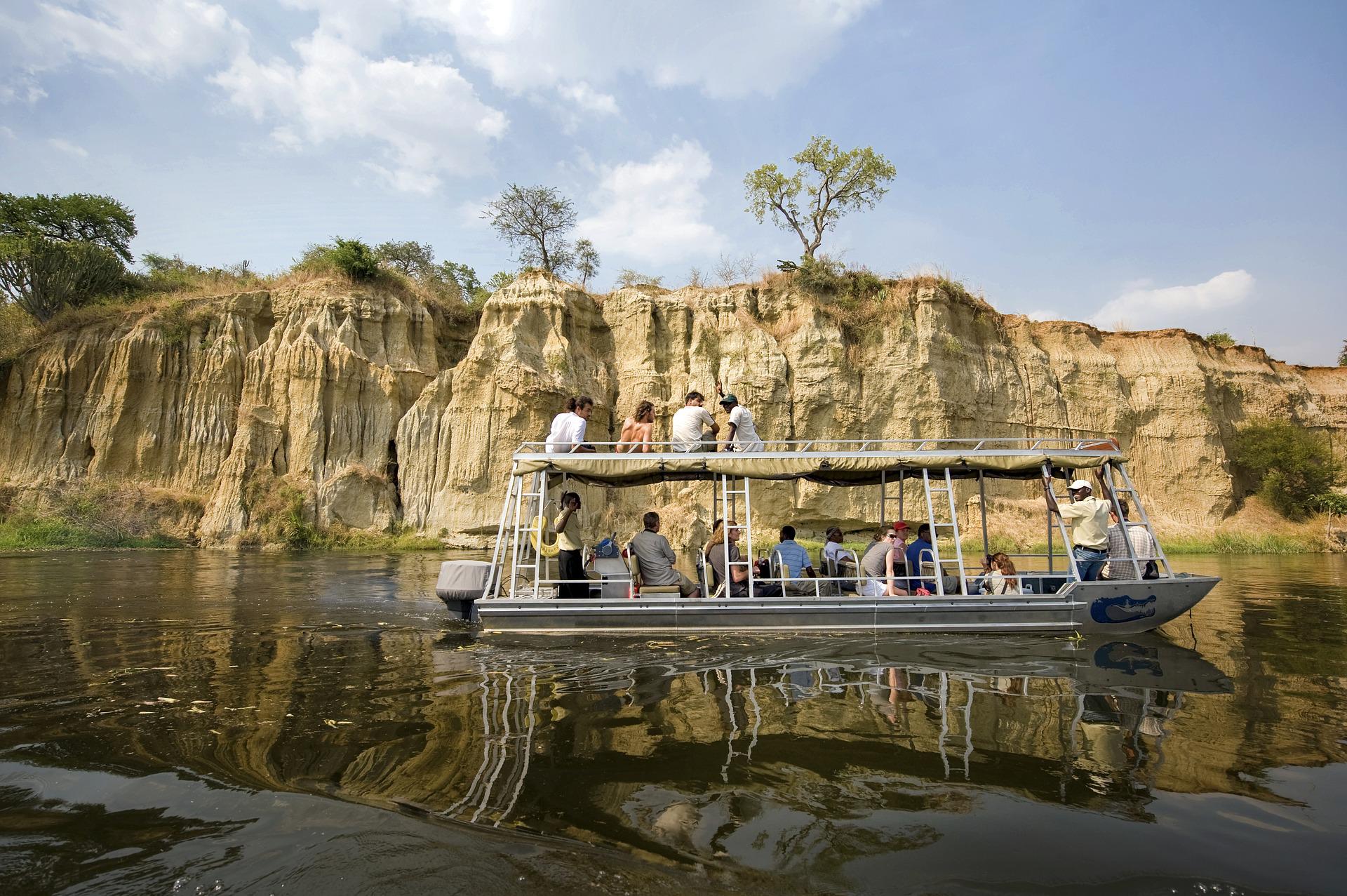 Tourist boat cruise on river with cliff formations
