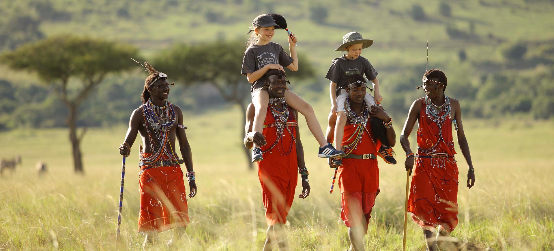 Maasai warriors with children in traditional dress